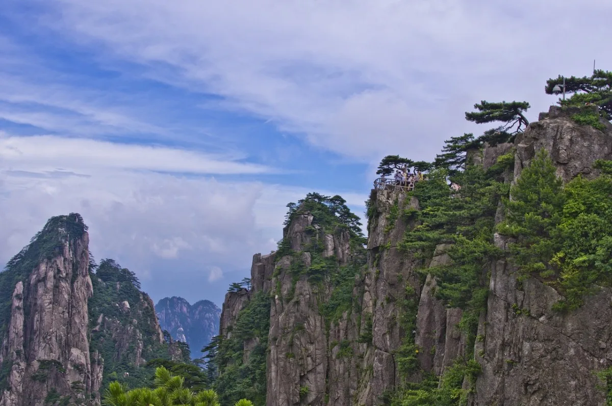 Sea of clouds rolling between Huangshan's weathered granite pinnacles